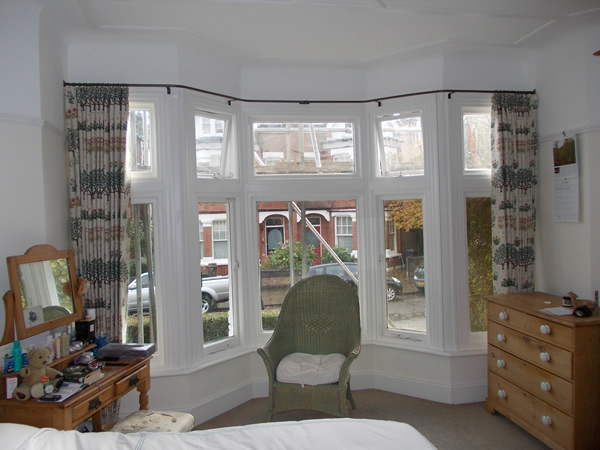 19mm wall to wall reverse bend baypole fitted in London the curtains stack back well