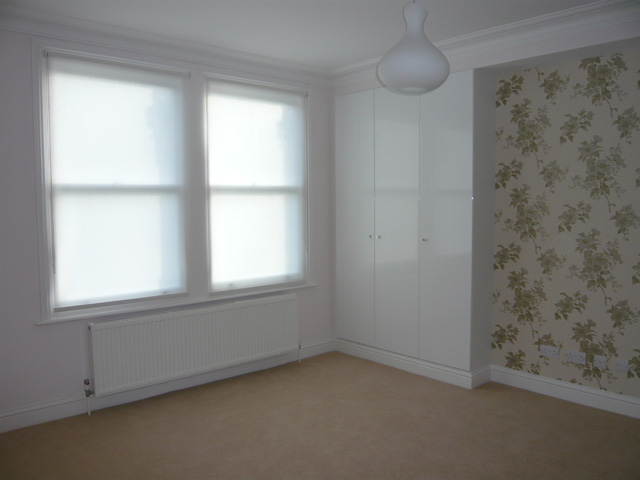 simple white roller blinds installede in Muswell Hill - Finchley