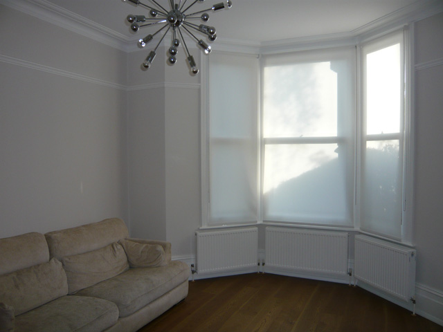 simple white roller blinds installede in Muswell Hill - Finchley