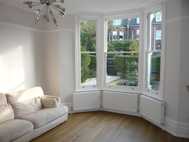 simple white roller blinds installede in Muswell Hill - Finchley