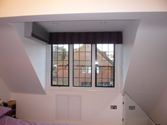 blackout roman blind with control chain fitted in Essex