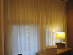 blackout roman blinds fitted behind voile curtains Highgate