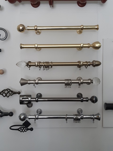 Display of metal poles in 6 colours - Changing Curtains Shop Display