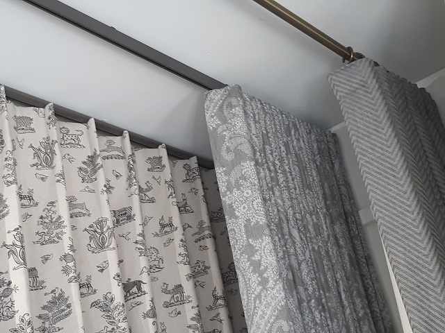 Wave Curtain stacked back on Silent Gliss Metropole - Changing Curtains Shop Display