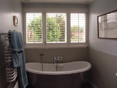 Plantation shutters in bathroom in highgate