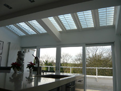 Roof shutters for shade in this kitchen overlooking Hampstead Heath