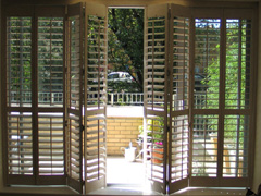 patio door shutters on a tracking system Hackney