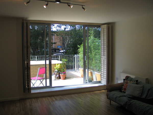 89mm louvres in lime white, hanging from tracking system