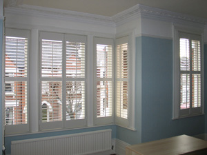 Full height shutters with 63mm louvre and a midrail for excellent control of privacy and light Highgate
