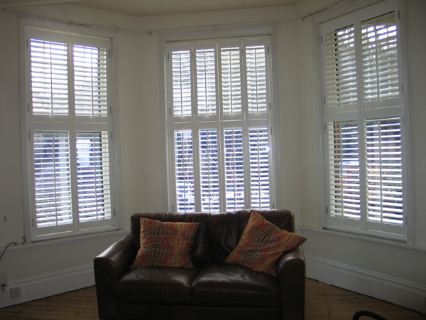 Silk white tier on tier shutters with 63mm louvres fitted in Muswell Hill, North London 