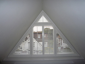 63mm silk white triangular shaped shutters Tufnell Park